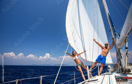 Happy couple on sailboat