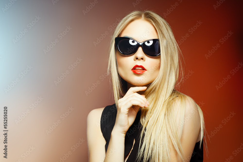Fashion woman in sunglasses, studio shot. Professional makeup Fashion woman in sunglasses, studio shot. Professional makeup