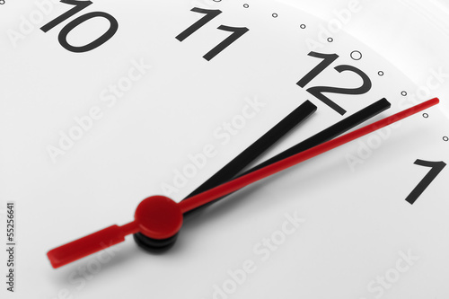 Clock face showing lunch time on white background