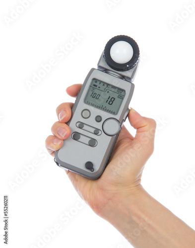 Light flash meter in hand isolated
