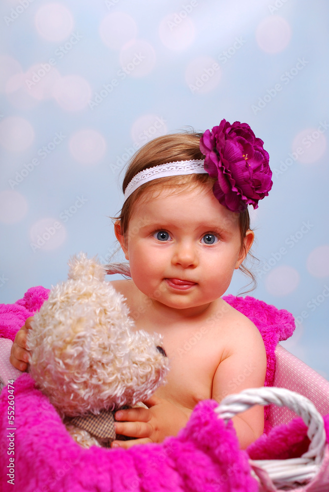 Fototapeta premium beautiful baby girl in wicker basket ,10 months
