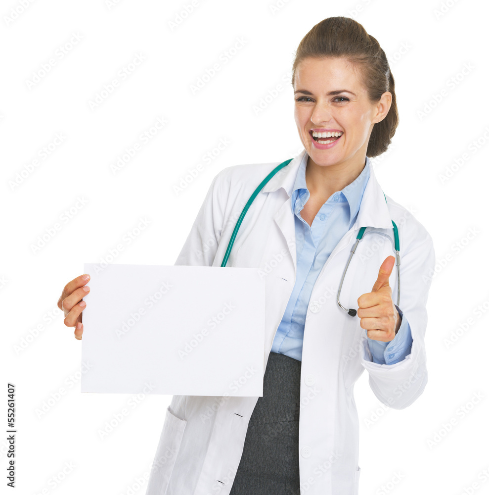 Happy doctor woman showing blank paper sheet and thumbs up Happy doctor woman showing blank paper sheet and thumbs up