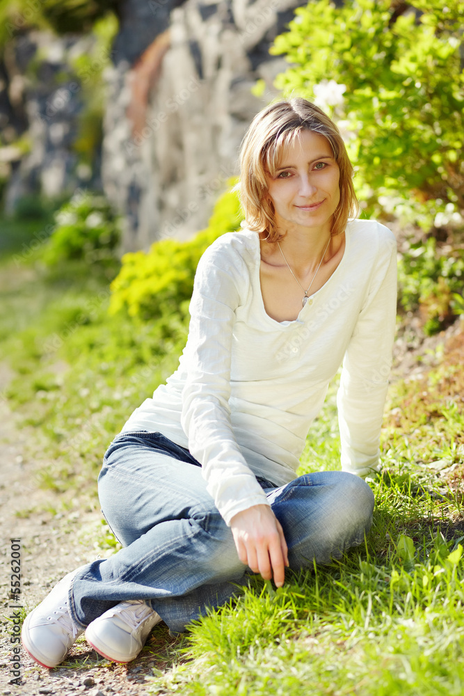 Portrait of smiling woman in a park Portrait of smiling woman in a park