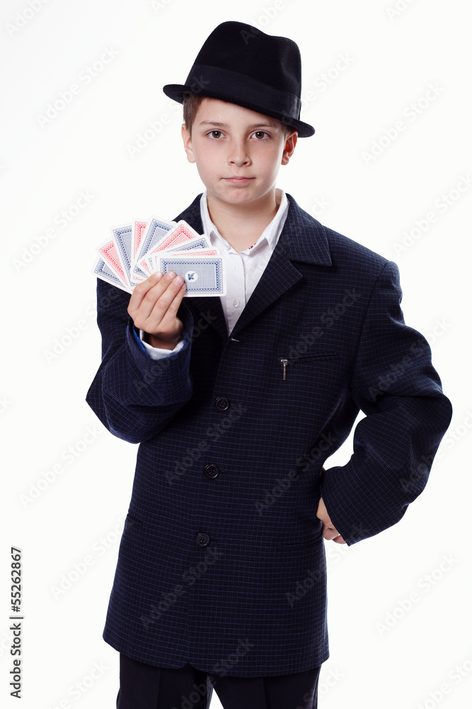 Portrait of a young boy holding playing cards Portrait of a young boy holding playing cards