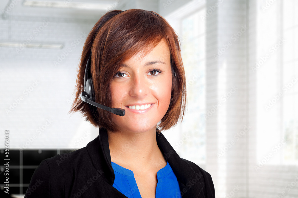 Portrait of a pretty customer agent at work in the office Portrait of a pretty customer agent at work in the office
