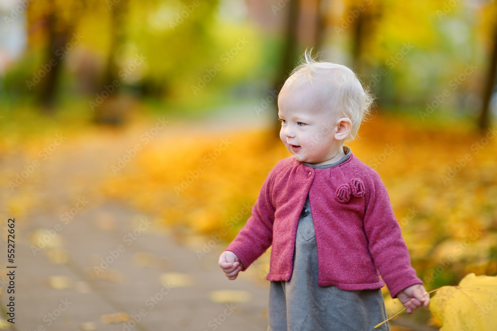 Adorable girl having fun on beautiful autumn day Adorable girl having fun on beautiful autumn day