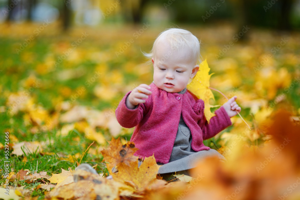 Adorable girl having fun on beautiful autumn day Adorable girl having fun on beautiful autumn day