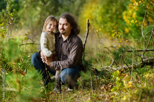 Young father and his little daughter at fall © MNStudio