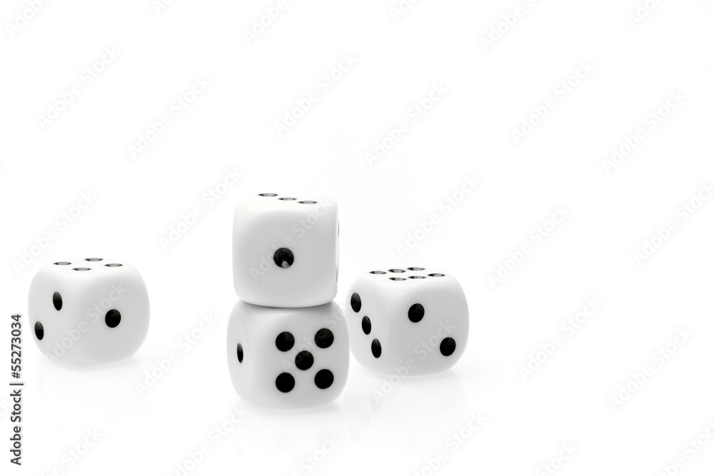 pure white dice on white table with space for text pure white dice on white table with space for text