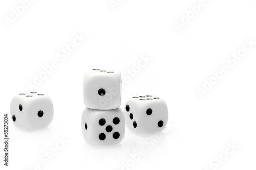 pure white dice on white table with space for text