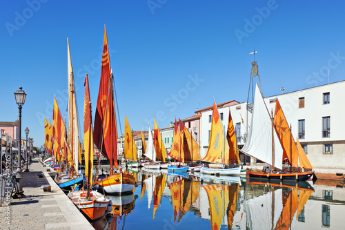 Boats of the Maritime Museum along the canal port in Cesenatico photo