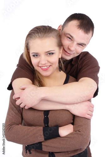 Loving couple embracing on white background