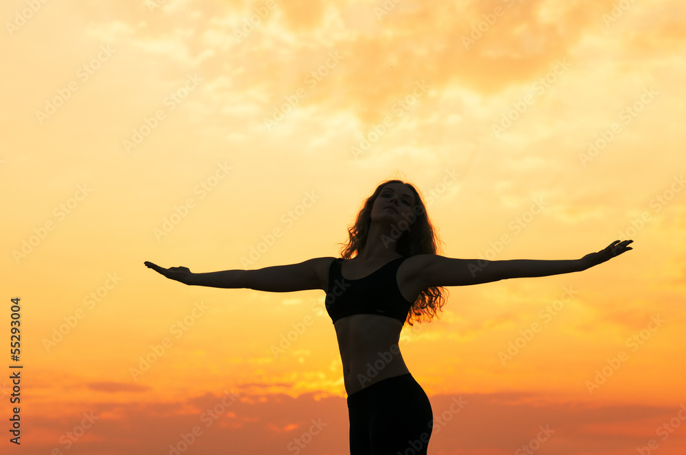 girl dancing in the sunset