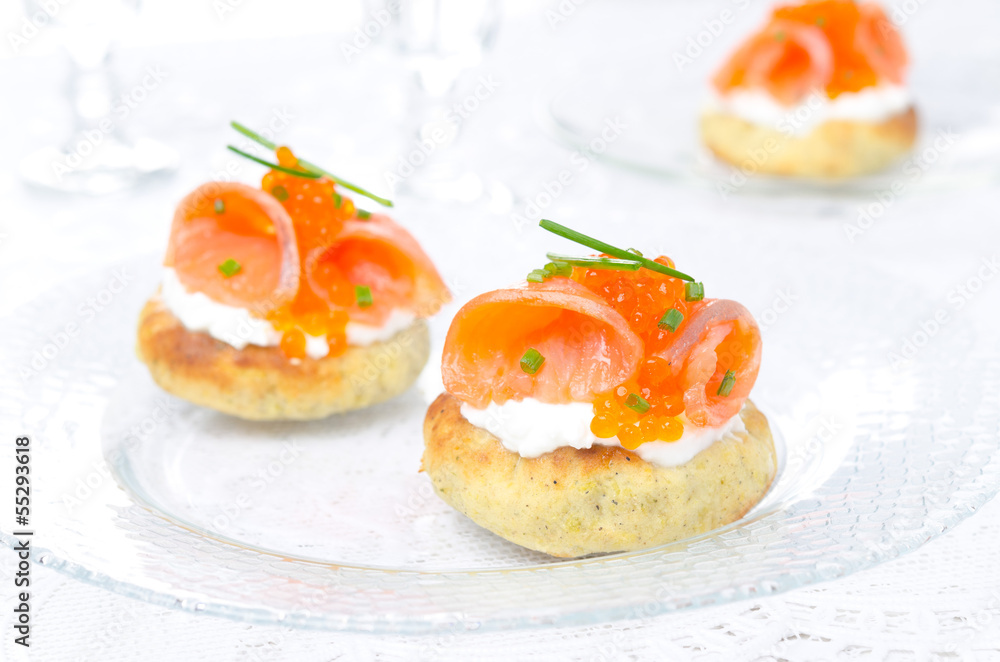 potato bun with salmon, red caviar and green onion