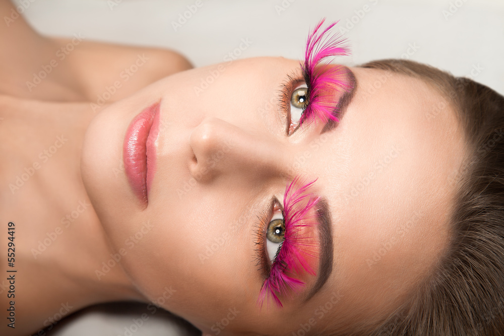 Beautiful young woman with a long lashes