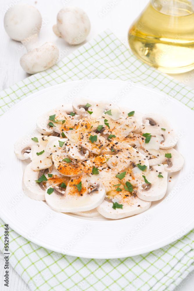 salad of fresh mushrooms with red pepper, olive oil