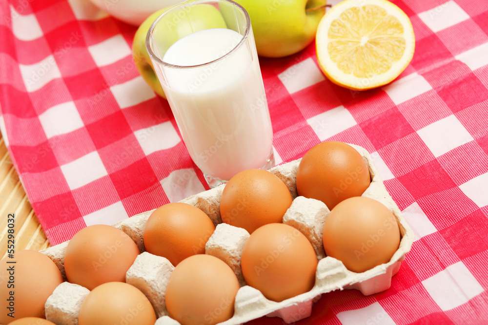 Milk in a glass jar and eggs Milk in a glass jar and eggs