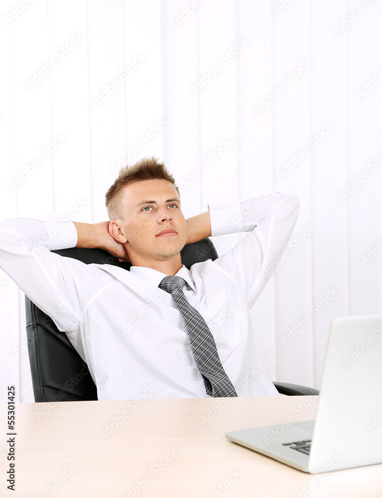 Portrait of young businessman in office Portrait of young businessman in office