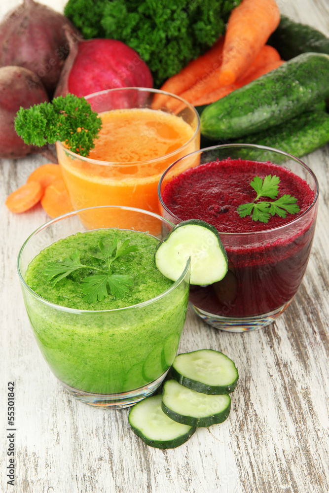 Fresh vegetable juices on table close-up Fresh vegetable juices on table close-up