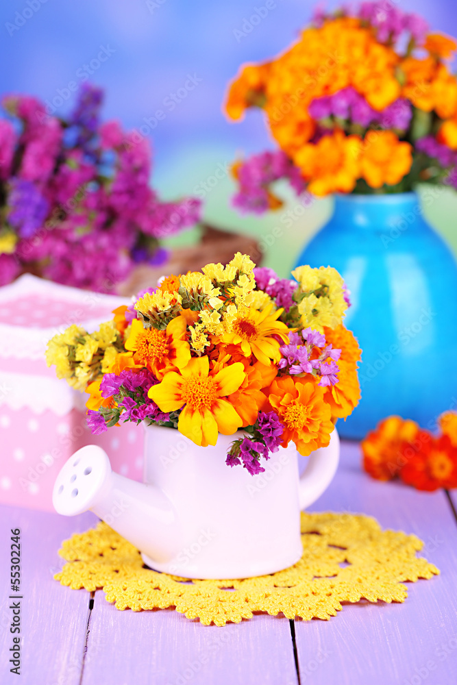 Bouquet of marigold flowers in watering can