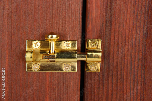 Fényképezés Metal latch in wooden door close-up