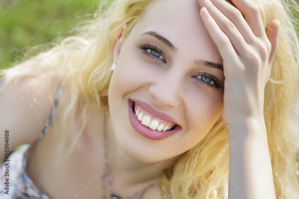 Beautiful happy smiling girl looking up to the camera Beautiful happy smiling girl looking up to the camera