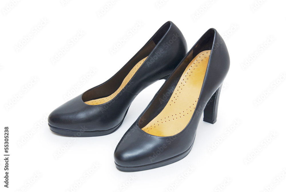Close-up of female high-heeled shoes over white background Close-up of female high-heeled shoes over white background