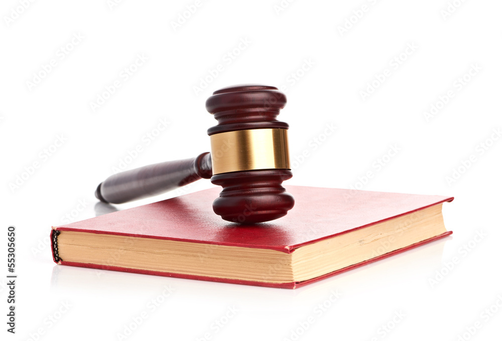 Judge's gavel on red legal book