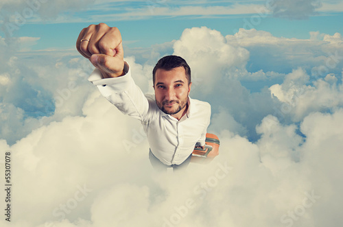 man flying through the clouds