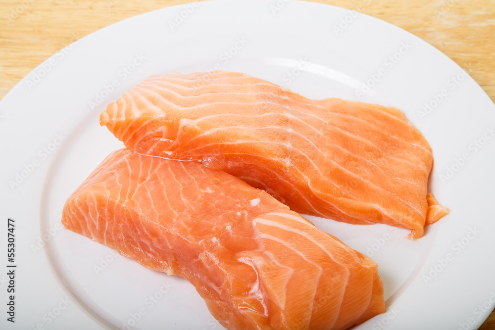 Two Atlantic Salmon Fillets on White Plate