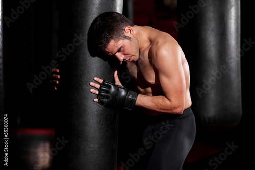 Training with a punching bag © AntonioDiaz
