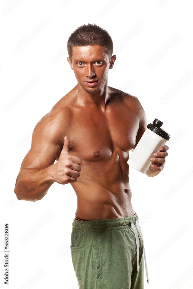 Muscular man holding a plastic bottle and showing thumbs up Muscular man holding a plastic bottle and showing thumbs up