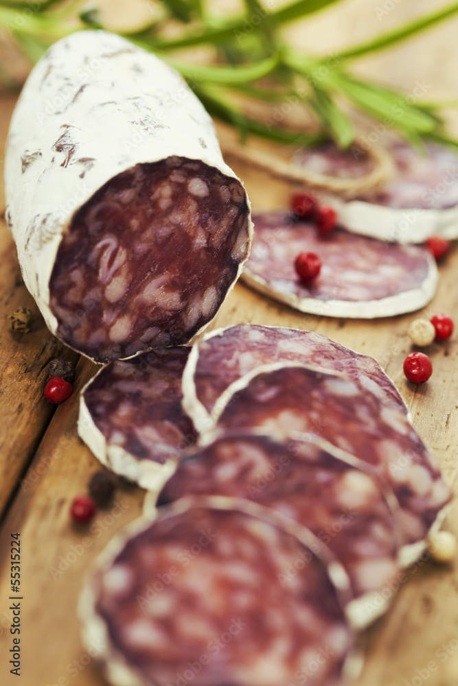 traditional sliced meat sausage salami on wooden board traditional sliced meat sausage salami on wooden board