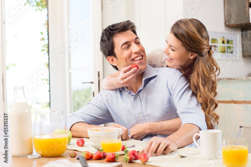 Happy Young Couple Enjoying Breakfast