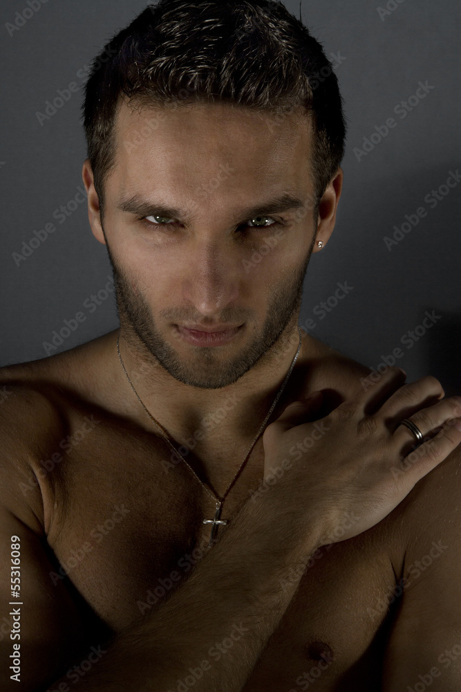 Obraz premium Portrait of sexy naked man posing in studio