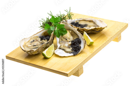 Oysters with black cavair photo