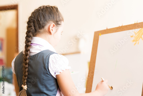 girl in apron painting