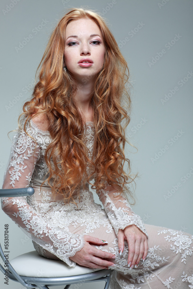 Plakat portrait elegant redheaded girl is in lace clothes