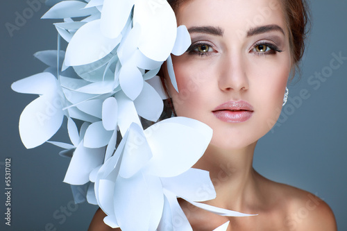 Wonderful girl in a hat from paper white butterflies photo