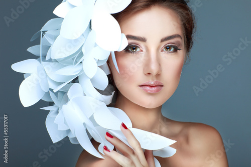 Wonderful girl in a hat from paper white butterflies photo