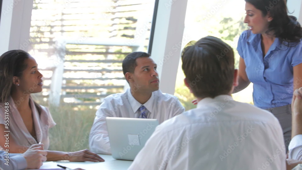 Group Of Businesspeople At Table Having Meeting Group Of Businesspeople At Table Having Meeting