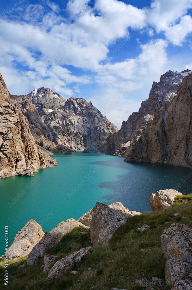 Severe high rocks both amazing high-mountainous lake and the