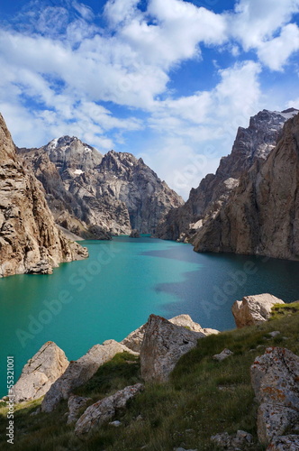 Severe high rocks both amazing high-mountainous lake and the