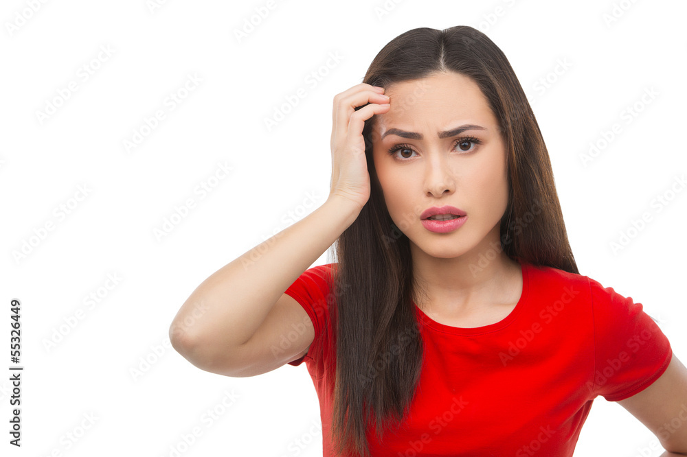 Frustrated woman. Depressed young woman holding her hand in hair Frustrated woman. Depressed young woman holding her hand in hair