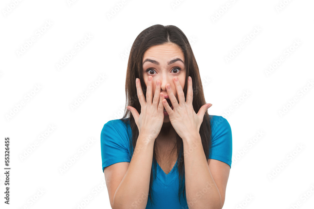 Terrified woman. Shocked young woman covering her mouth with han Terrified woman. Shocked young woman covering her mouth with han