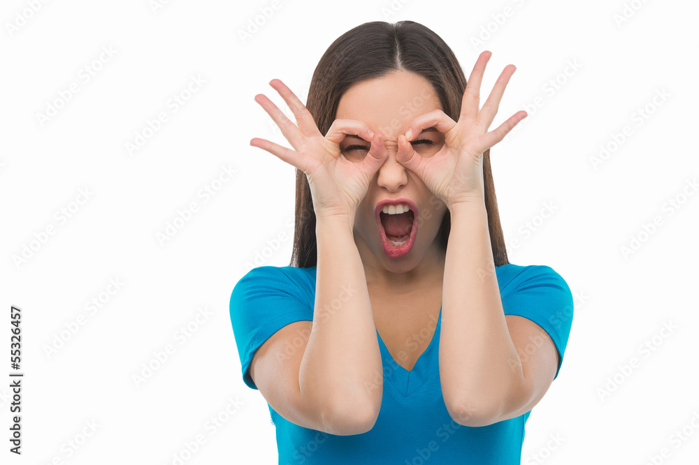 Making a face. Young woman making a face and grimacing while iso Making a face. Young woman making a face and grimacing while iso