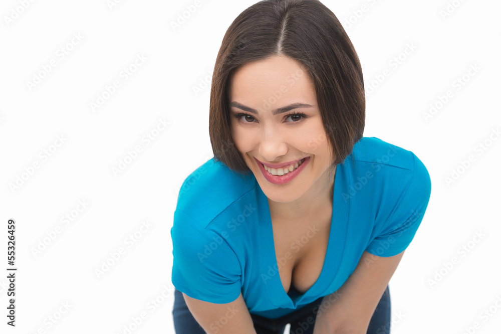 Happy woman. Cheerful young woman stretching out hand and lookin Happy woman. Cheerful young woman stretching out hand and lookin