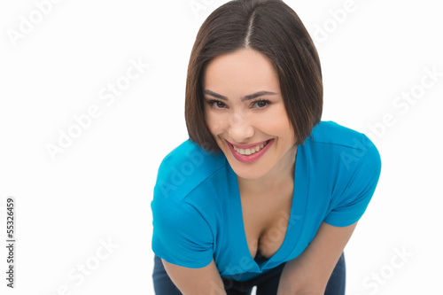 Happy woman. Cheerful young woman stretching out hand and lookin