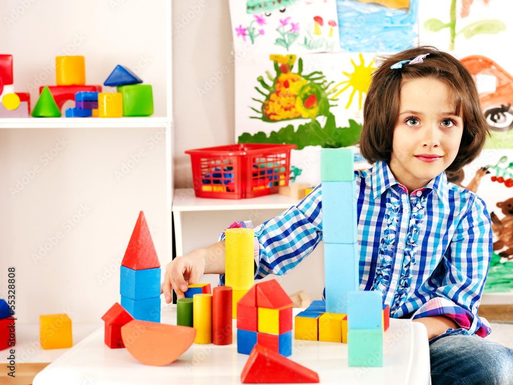 Child playing bricks. Child playing bricks.