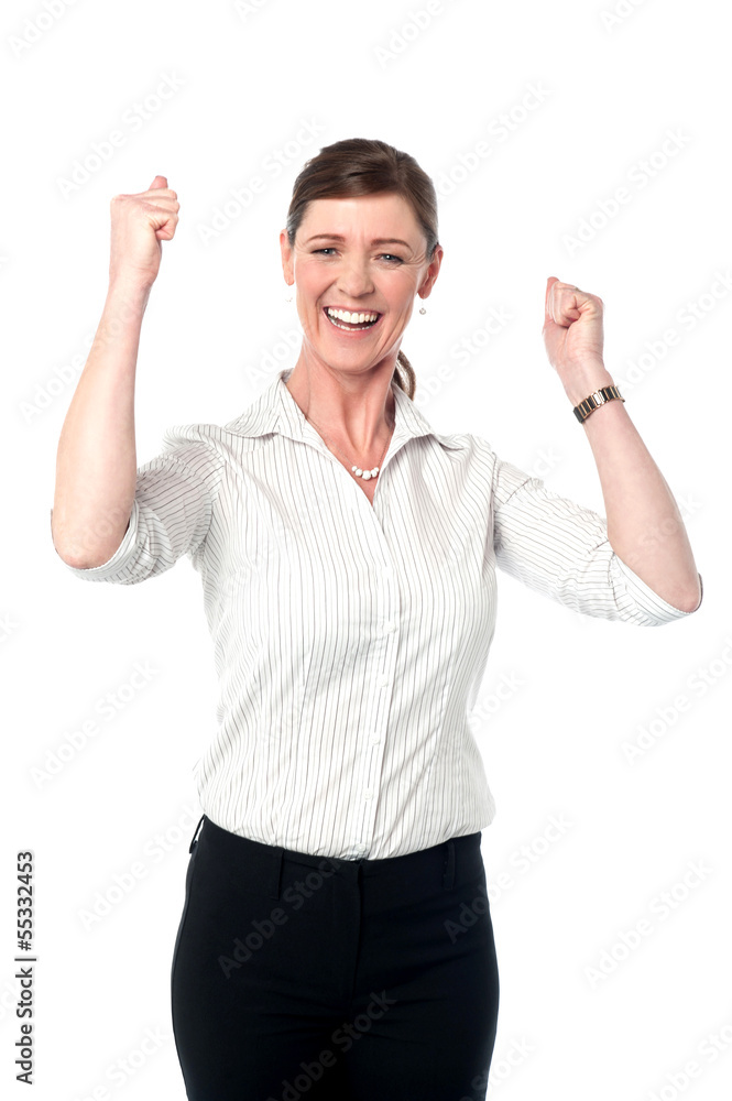 Excited corporate lady with clenched fists